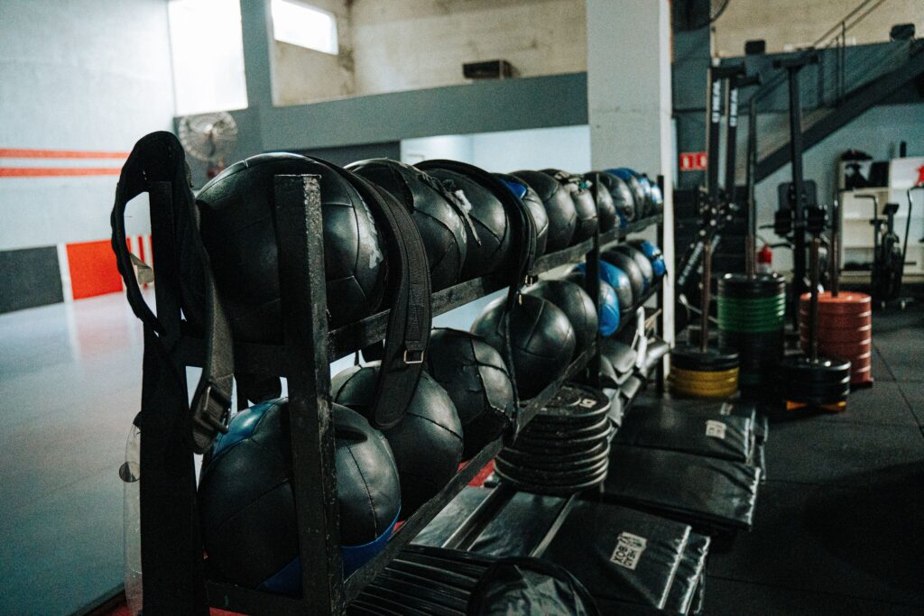 Well-equipped indoor gym featuring kettlebells, weights, and workout gear, perfect for fitness enthusiasts.