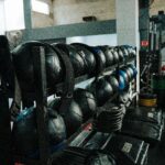 Home Well-equipped indoor gym featuring kettlebells, weights, and workout gear, perfect for fitness enthusiasts.